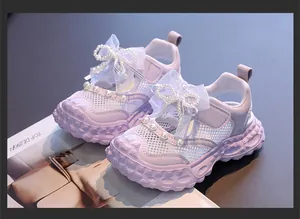 Close-up view of lilac girls' princess sandals featuring elegant pearl bows and mesh detail