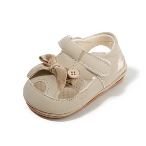 Beige baby girl walking sandals with soft velvet bow, breathable closed-toe princess shoes