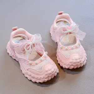 Adorable pink mesh princess sandals for little girls with lace bow and pearl bead details
