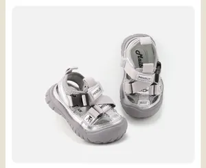 Detailed close-up view of grey toddler summer sandals with velcro straps and breathable mesh