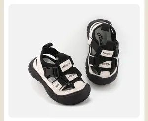 Detailed view of children's breathable sandals with black and white velcro straps