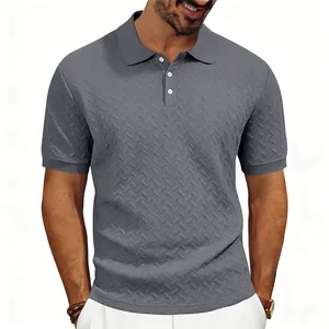 Detailed macro view of mens grey polo shirt featuring zigzag jacquard textured fabric