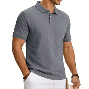 Macro view of grey men's polo shirt featuring a textured chevron jacquard pattern