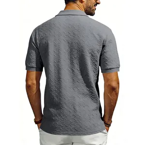 Back view of a grey men's polo shirt with geometric jacquard texture and relaxed fit