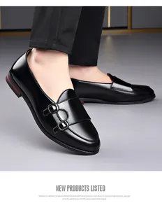 Detailed macro view of men's elegant black leather monk strap loafers with dual buckles