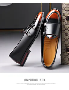Detailed view of burnished orange and black double monk strap loafers