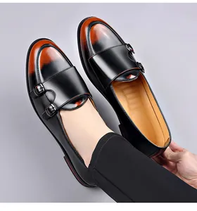 Close-up of men's double monk strap leather shoes with vintage brown ombre finish.