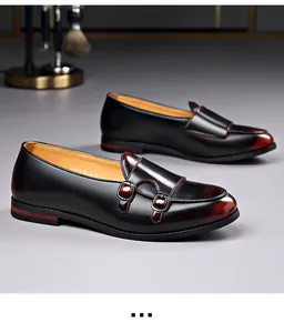 Detailed view of retro British style men's black leather monk strap loafers.