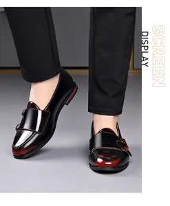 Close-up of vintage British men's loafers in black and red gradient with monk strap