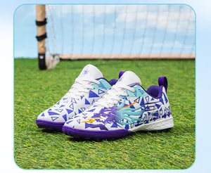 Professional children's TF turf soccer shoes in white and purple with dynamic dragon patterns