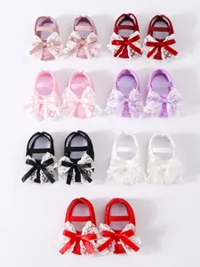 Selection of newborn soft-sole baby shoes featuring delicate lace bows in various colors