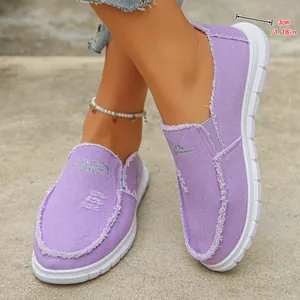 Detail of lavender canvas slip-on loafers with 3cm sole and distressed edges