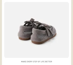 Detailed back view of grey toddler girls sandals featuring a plaid bow and mesh detail
