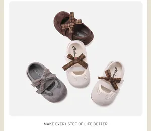 Toddler girl mesh flat sandals with plaid bow decoration in brown, grey and beige.