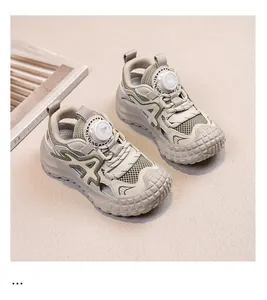 Close-up of boys mesh sneakers with tire-pattern thick sole and rotary dial