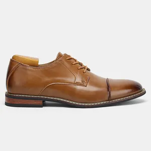 Side view of classic brown men's business leather dress shoes with stitching detail