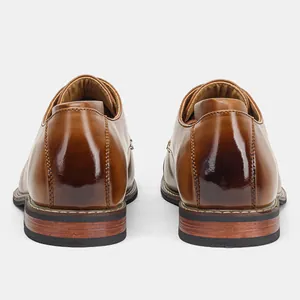 Rear view of brown leather men's dress shoes showing polished finish and sole detail