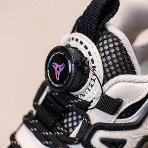 Close-up detail of boys' breathable mesh sneakers featuring a rotary buckle closure.