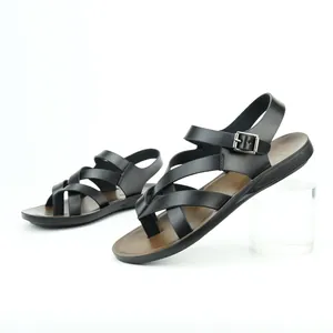 Detailed side view of black men's Roman sandals with toe-loop and soft brown sole.