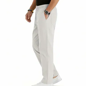 Detailed side view of men's casual white drawstring straight-leg trousers with pockets