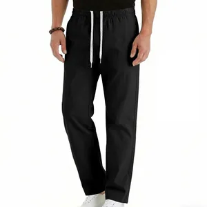 Close-up detail of men's casual black straight-leg pants with white drawstring waist