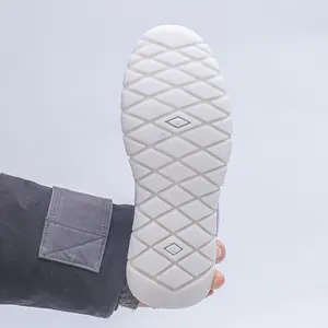 Detailed view of the anti-slip white rubber sole with diamond tread pattern
