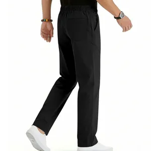 Rear view detail of men's loose black straight-leg casual trousers with elastic waist.