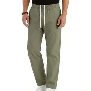 Detail view of breathable men's olive straight-leg pants with adjustable drawstring.