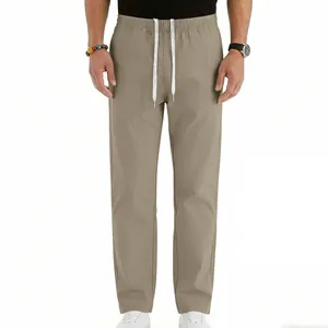 Front view detail of men's khaki drawstring trousers with a relaxed straight-leg fit.