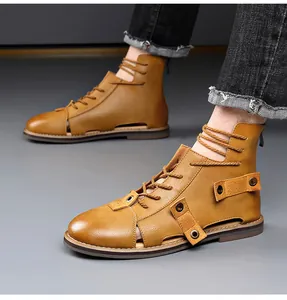 Detailed view of brown leather hollow-out Roman sandals with laces and back zipper