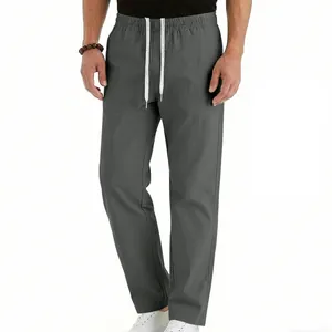 Close-up detail of men's grey breathable straight-leg casual trousers with drawstring waist