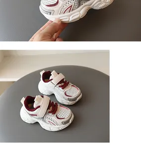 Close-up detail of boys' breathable mesh running sneakers with hook-and-loop strap