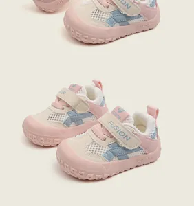 Detail view of pink and blue breathable mesh toddler shoes with soft non-slip soles.