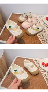 Detail shot of toddler breathable mesh princess shoes with cute cherry decoration.