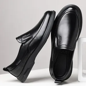 Men's sleek black business casual leather slip-on loafers with minimalist design