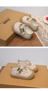 Detailed close-up of breathable mesh toddler princess shoes with cherry embroidery accents