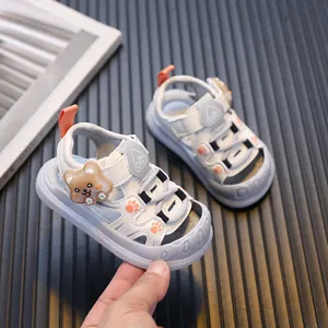 Adorable cartoon bear LED light-up toddler sandals featuring soft soles for walking