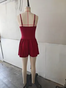 Back view detail of a comfortable red spaghetti strap romper displayed on a female mannequin