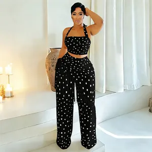 Ensemble chic à pois noir et blanc avec haut dos nu et pantalon large à franges femme