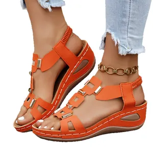 Stylish women's orange peep toe wedge sandals with comfortable elastic back strap and metal accents