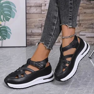 Side view of black women's platform sandals with strappy Roman design and velcro straps