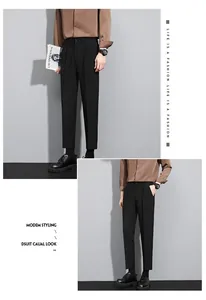 Model showcasing slim fit black business trousers with a professional and stylish aesthetic