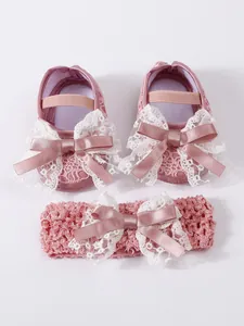 Pink lace baby shoes and matching bow headband set for newborn girl's formal dress
