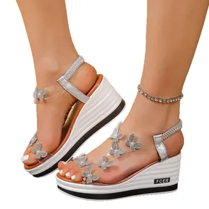 Elegant silver wedge sandals with rhinestone butterflies and clear straps