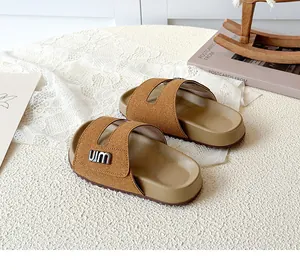 Close-up view of brown children's Mori-style Birkenstock sandals with soft suede straps.
