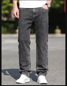 Detailed view of men's loose straight-leg jeans in a stylish smoky grey wash finish
