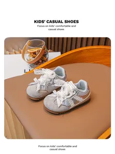 Baskets argentées pour enfants avec nœuds en dentelle élégants et maille respirante.