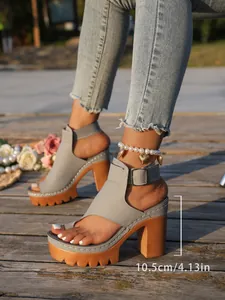 Close-up detail of grey chunky high heel platform sandals showing the 10.5cm heel height