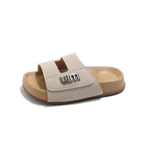 Stylish children's breathable beach slides in minimalist beige with chic metal hardware