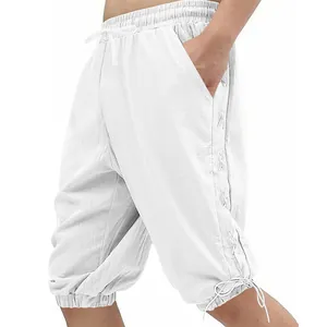 Close-up detail of men's white vintage Viking style lace-up casual shorts with linen texture